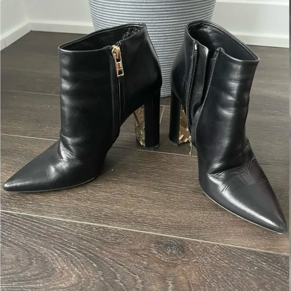Burberry Black leather ankle boots with gold zipper detail #boots